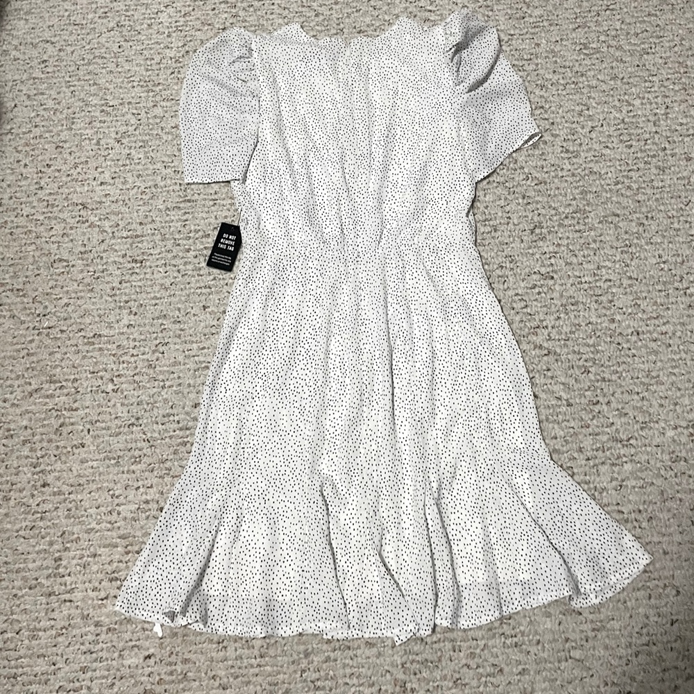 White with black polka dot dress with ruffle short sleeve.